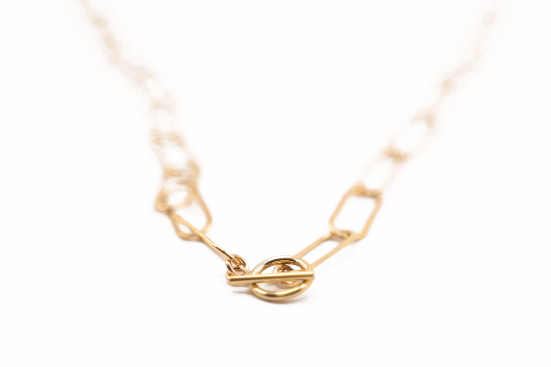 Gold necklace product photography in Santa Cruz California taken by Santa Cruz wedding and elopement photographer and videographer 