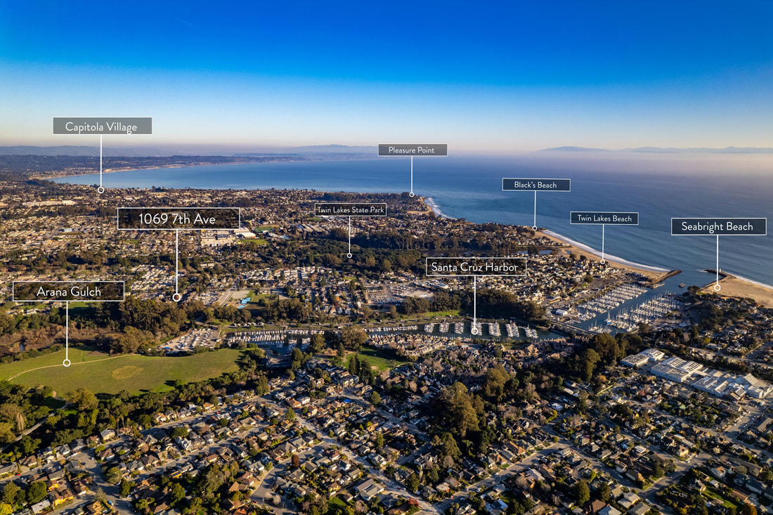 Landscape drone view of Santa Cruz, California luxury real estate listing.