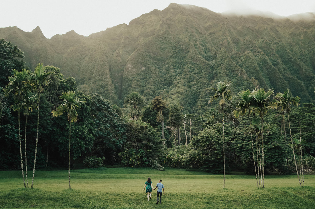 Couple climbing mountain on Oahu with Santa Cruz Wedding Elopement Photographer Videographer