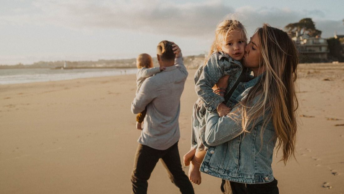Santa Cruz based family photographer with local family at beach