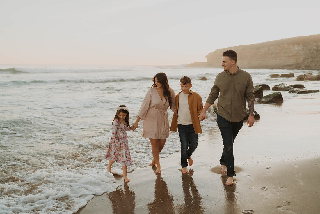 Santa Cruz family taking photos at the beach with local photographer