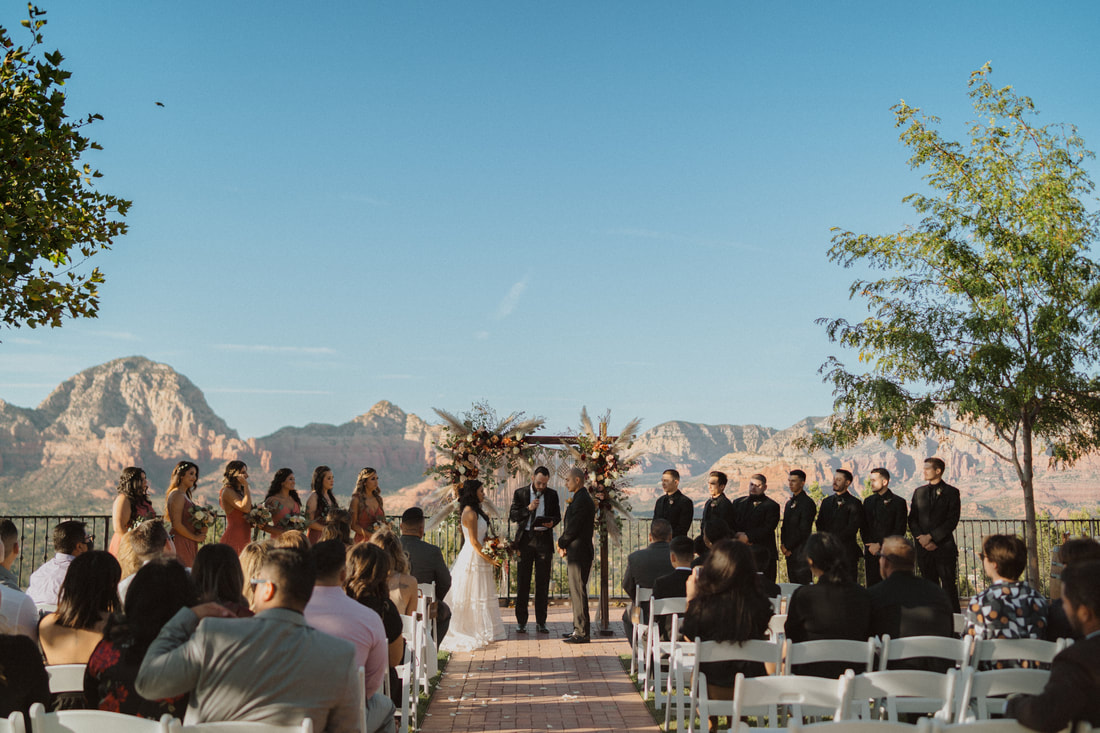 Sedona wedding with couple overlooking mountains during ceremony