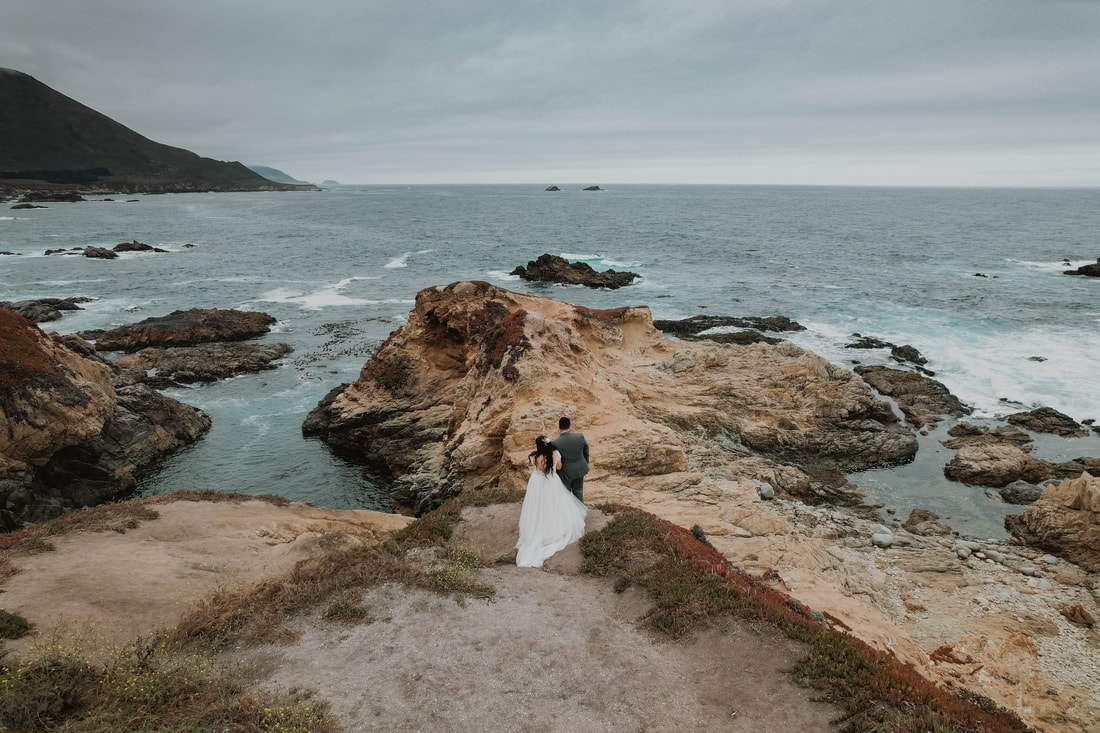 Couple looking out at the ocean in Big Sur elopement at Folktale Winery 