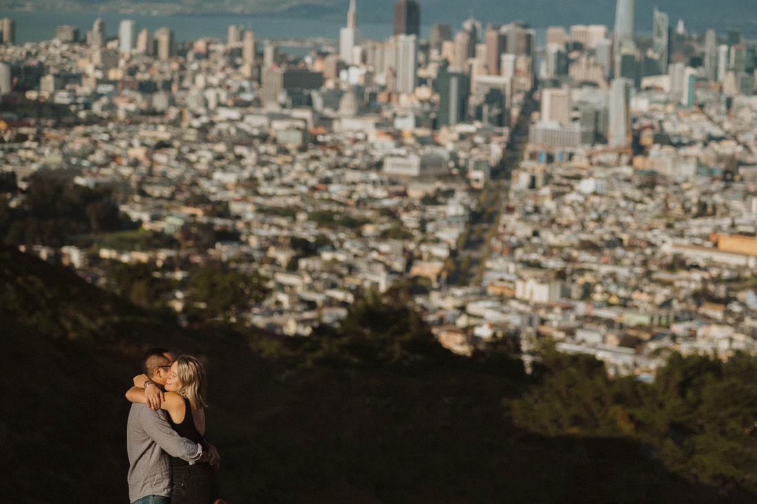Couple hugging in San Francisco taken by Santa Cruz wedding and elopement photographer and videographer 