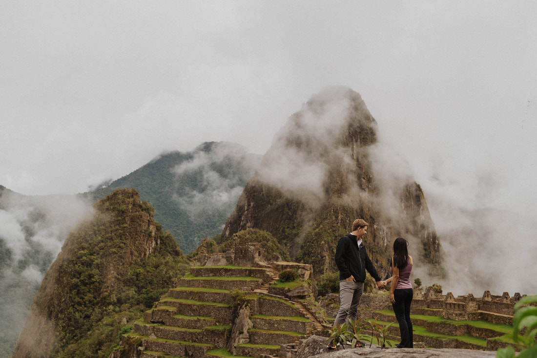 Couple holding hands in machu picchu taken by Santa Cruz wedding and elopement photographer and videographer 