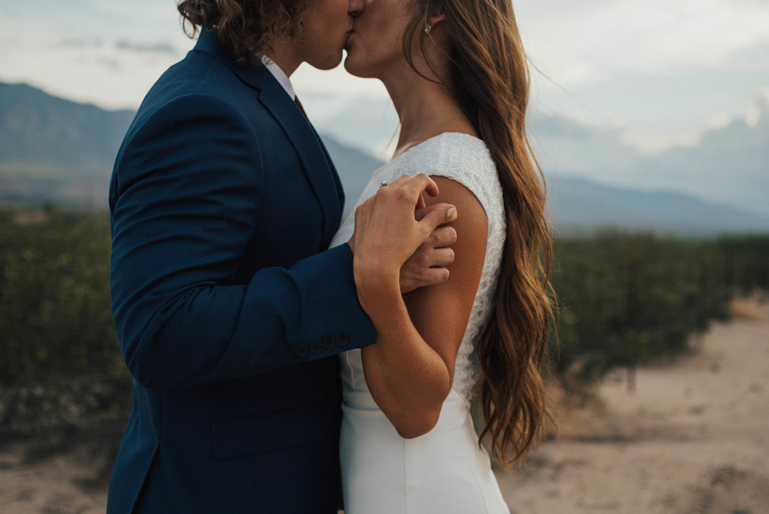 Couple kissing in Mexico wedding with Santa Cruz wedding photographer and videographer