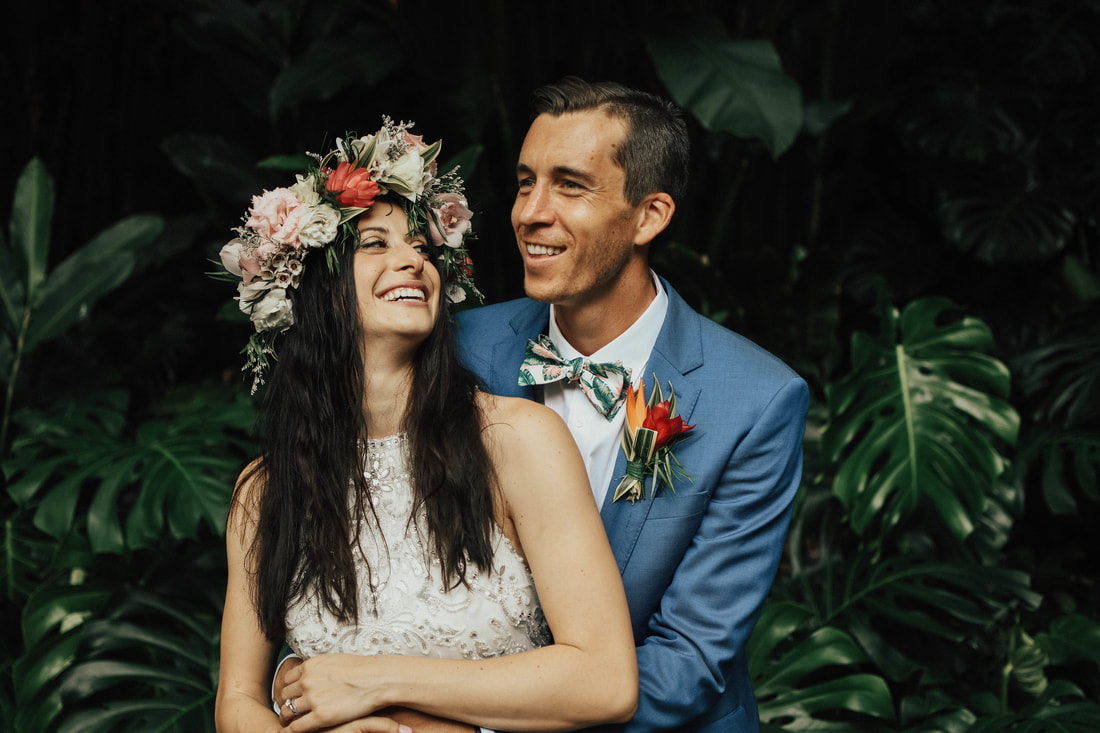 Couple laughing at their wedding in Waimea Valley Oahu with Santa Cruz wedding photographer and videographer